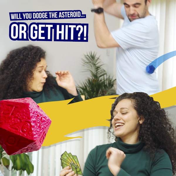 Two people playing with a red and green giant squishy foam Asteroid Dice with text about dodging an asteroid.